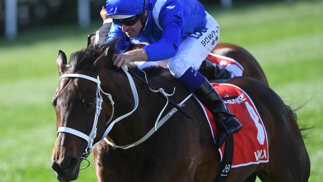 Hugh Bowman rides Winx to victory in the Cox Plate. Picture: AAP
