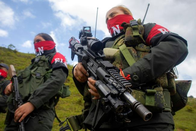 National Liberation Army ELN rebels of the Manuel Vazquez Castano northeastern war front  stand guard at Catatumbo region, Colombia on March 8, 2025. Commanders from Colombia's National Liberation Army guerrilla group have vowed to repel a government counteroffensive in the country's northeast, warning years of "total peace" risk turning into "total war". 