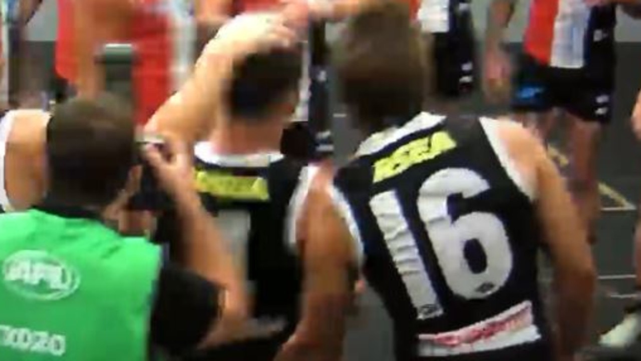 Saint Dan Butler appears to grope at teammate Jade Gresham's backside.