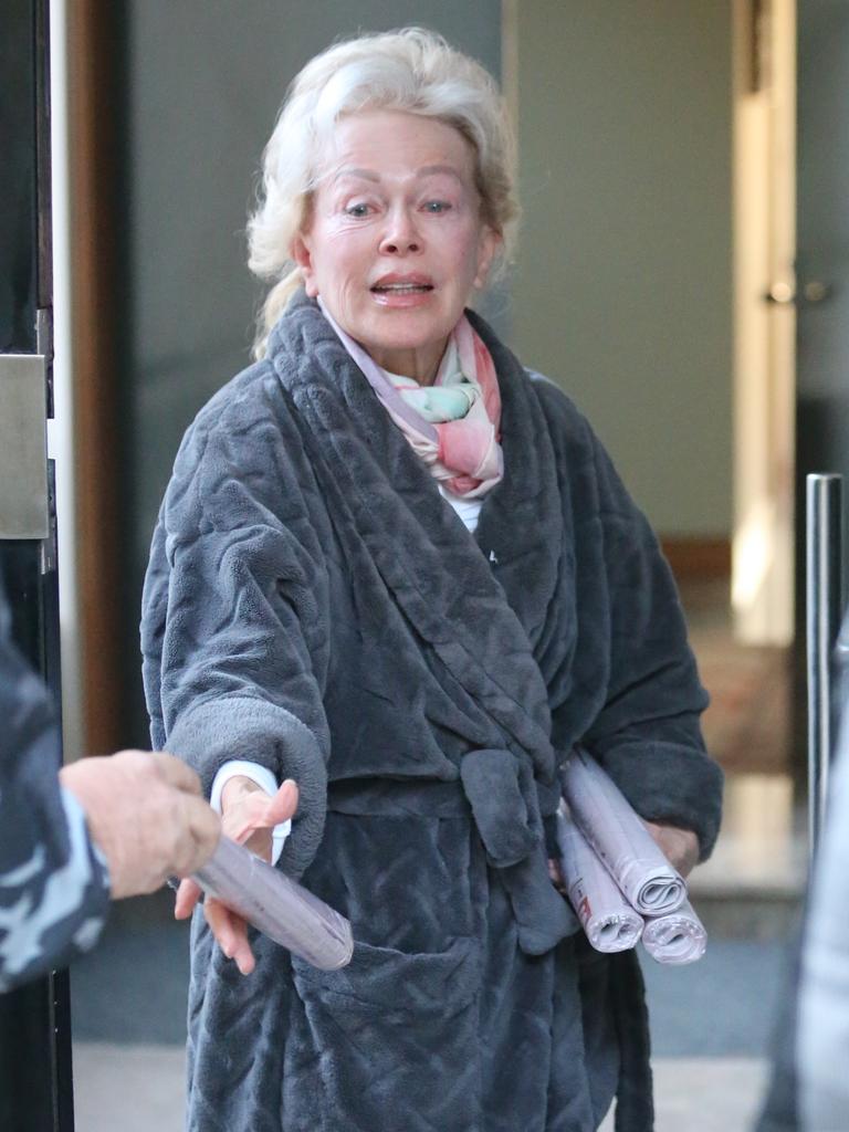 Ms d’Alpuget stepped outside to pick up newspapers which paid tribute to her husband. Picture: John Grainger