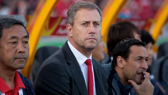 China's national coach Alain Perrin sits on the bench during the AFC Asia Cup soccer match between China and North Korea in Canberra, Australia, Sunday, Jan. 18, 2015. (AP Photo/Andrew Taylor)