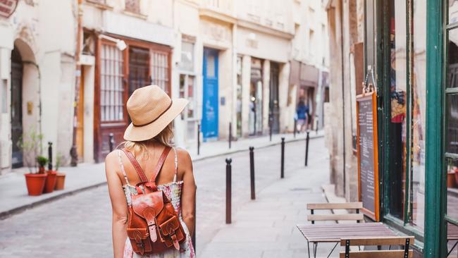 woman tourist on the street, summer fashion style, travel to Europe