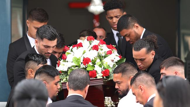 Rugby league players Jason Saab (right, rear) and Stefano Utoikamanu (right) carry the coffin of close friend Keith Titmuss in 2020. Picture: Brett Costello