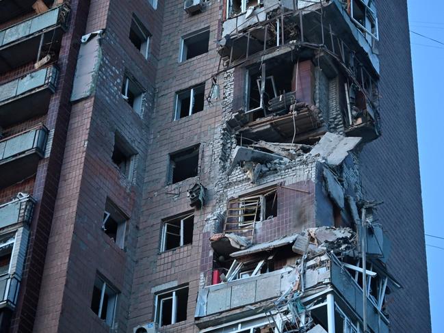 This photograph taken on April 4, 2024 shows a residential building damaged as a result of a missile attack in Kharkiv, amid the ongoing Russian-Ukrainian conflict. Russian air strikes overnight in Ukraine's second largest city Kharkiv killed four people and injured 11, officials said on April 4, 2024. (Photo by SERGEY BOBOK / AFP)