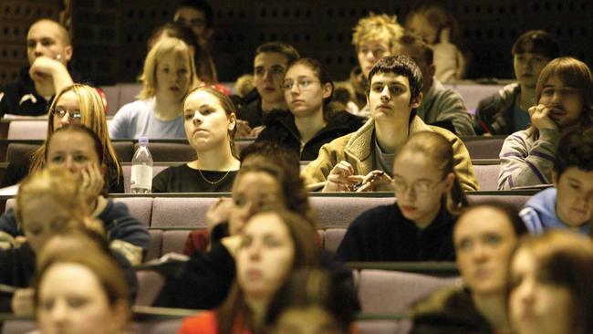 Students attend a university lecture. The University of Sydney has banned the traditional use of “he’’ to describe a generic person.