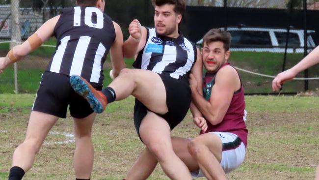 Ivanhoe's Fonda Kyriakos gets a hurried kick out of the middle against MHSOB Picture: PHIL SKEGGS.