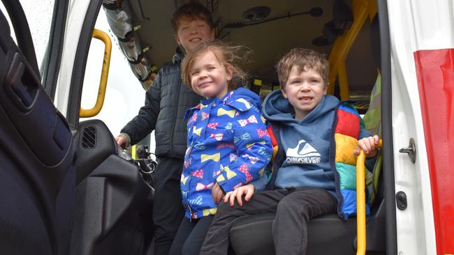 Louis Kenna, Lola Kenna and Harry explore the fire truck.