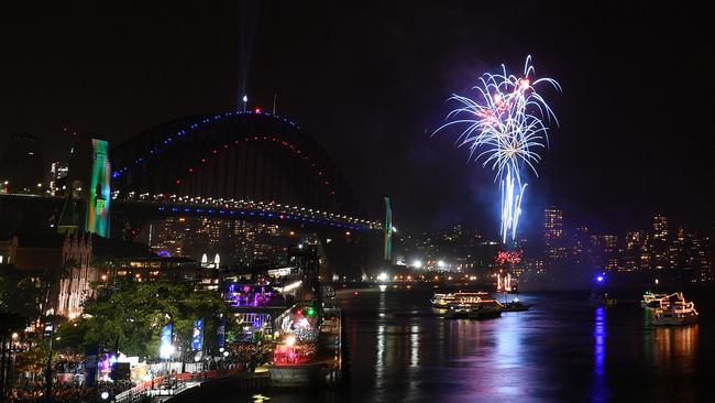 The family fireworks explode over the Sydney Opera House and Sydney Harbour Bridge. Picture: AAP