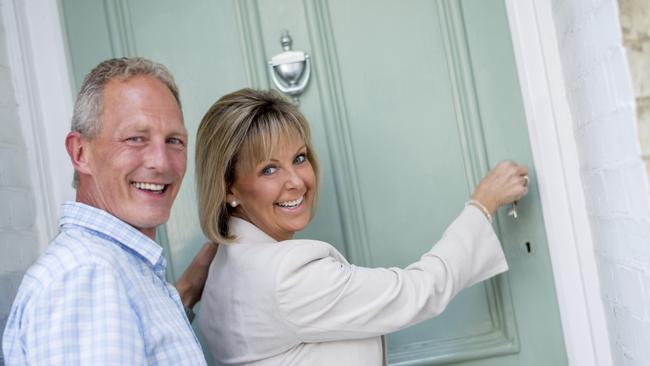 MONEYSAVER HQ: Happy couple arriving home and opening the door. Picture: iStock