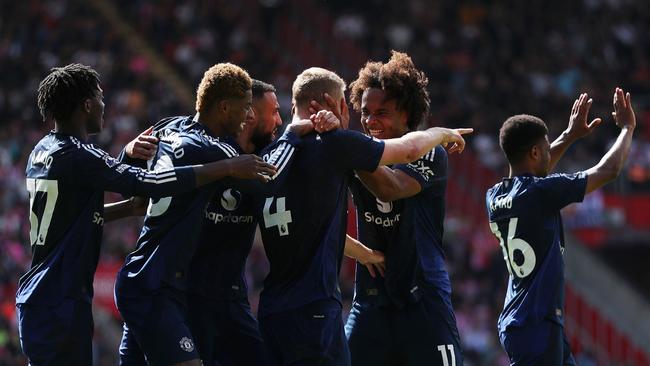 SOUTHAMPTON, ENGLAND - SEPTEMBER 14: Matthijs de Ligt of Manchester United celebrates scoring his team's first goal with teammates during the Premier League match between Southampton FC and Manchester United FC at St Mary's Stadium on September 14, 2024 in Southampton, England. (Photo by Ryan Hiscott/Getty Images)