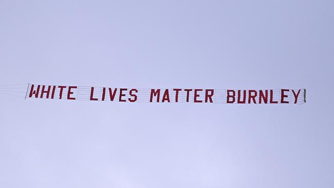 A plane towing a banner reading White Lives Matter Burnley flies above Etihad Stadium during the during the EPL game between Manchester City and Burnley
