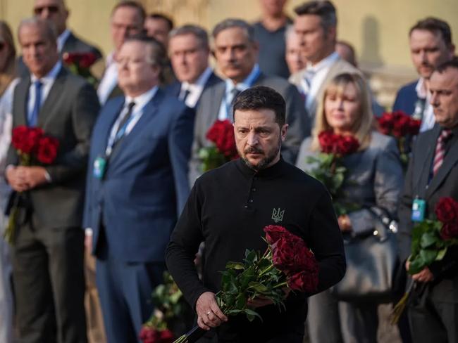 President Zelensky joined a day of mourning in Kyiv after 12 people were killed by Russian strikes on Thursday. Picture: Evgeniy Maloletka/AP