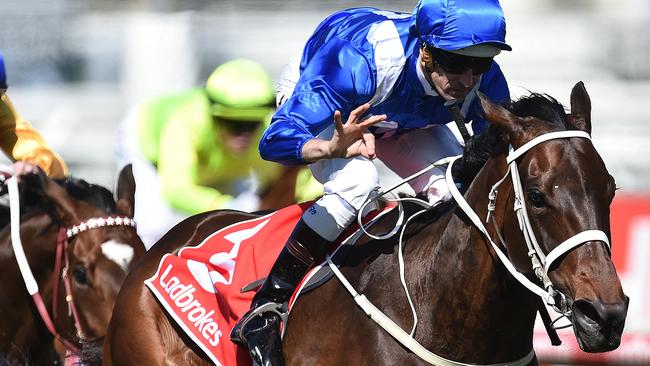 Hugh Bowman salutes after Winx added another Group 1 to her record.