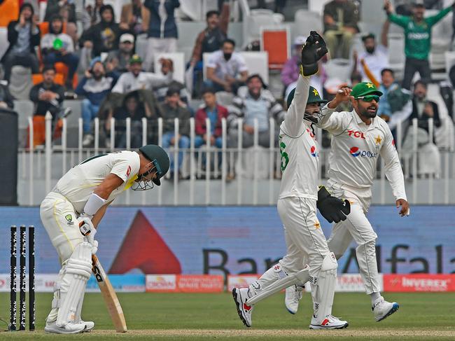 Pakistan’s off-spinner Sajid Khan dismisses Australian opener David Warner for 68 runs (from 114 balls) after lunch. Picture: Aamir QURESHI/AFP