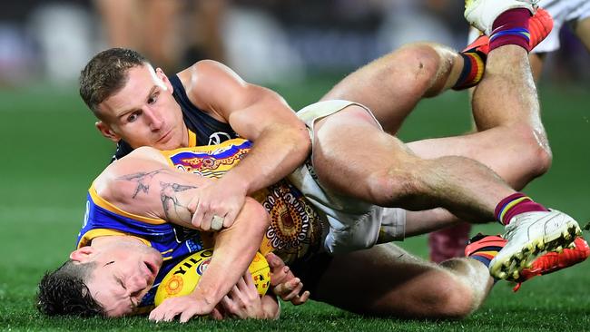 Lachie Neale of the Lions tackled by Rory Laird. Picture: Mark Brake/Getty Images