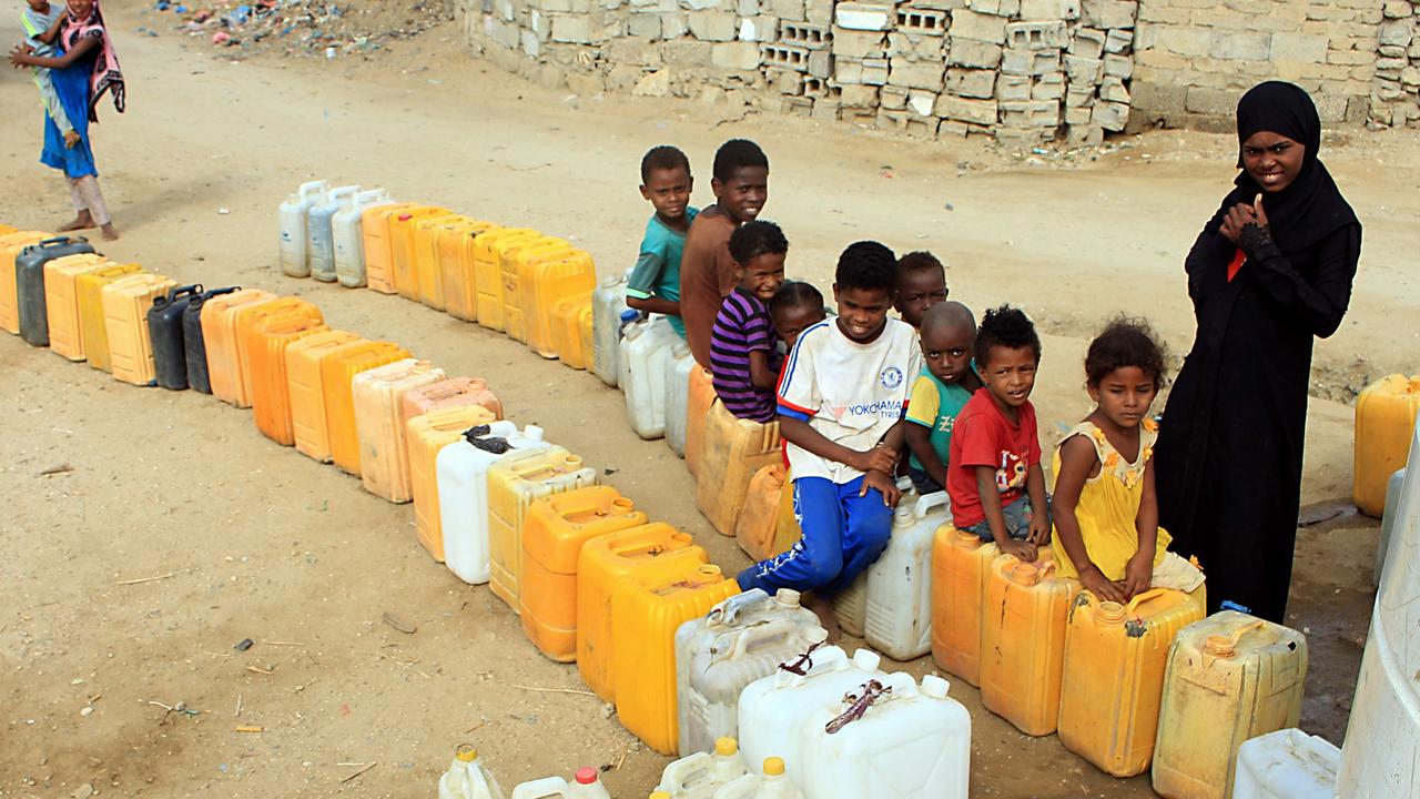 Displaced children from Hodeida wait for water supplies in a camp in Yemen’s northwest. Picture: Essa Ahmed/AFP