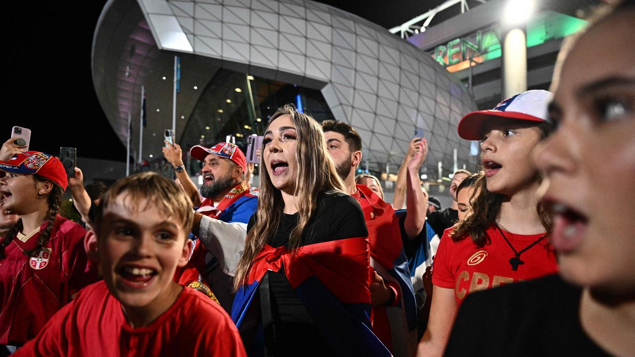 Supporters of Serbia's Novak Djokovic gather after his victory.