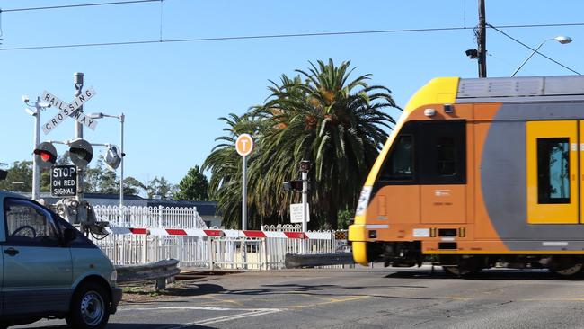 Traffic stops at the Richmond railway crossing to allow the trains to go through. Picture: Alan Sadleir