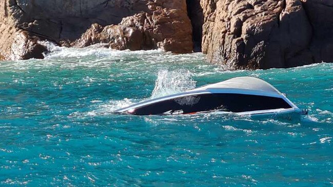 A capsized boat floating off Eshelby Island in the Whitsundays. Picture: VMR Whitsundays