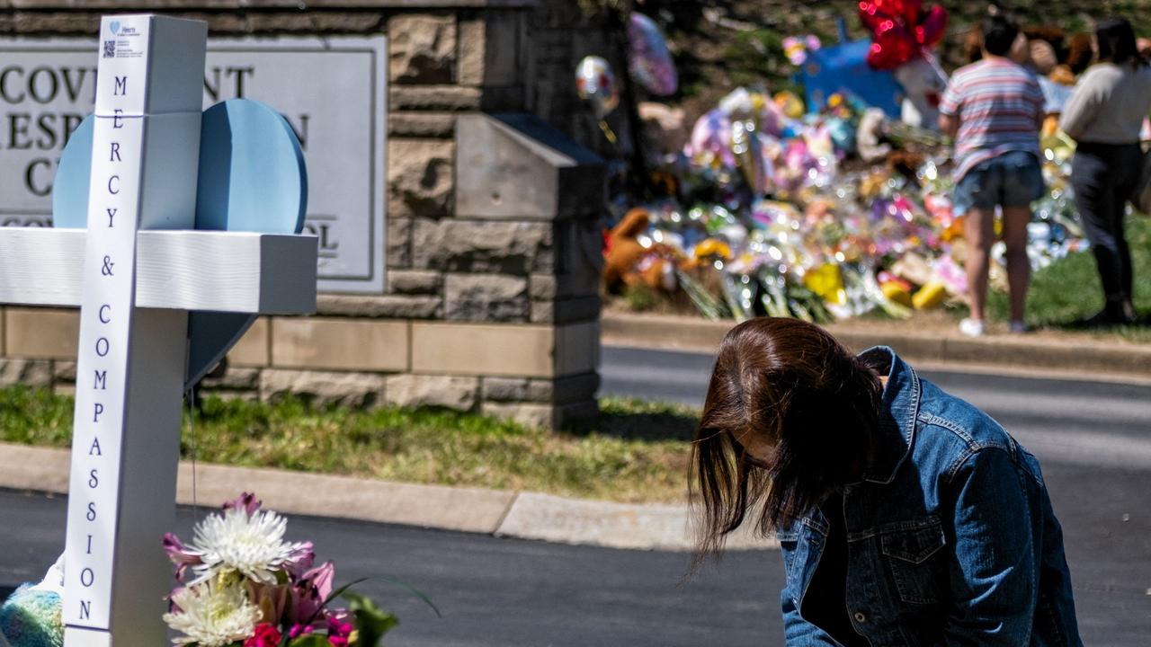 A woman prays at a makeshift memorial for those killed in a mass shooting at the entrance of The Covenant School this week. Picture: AFP