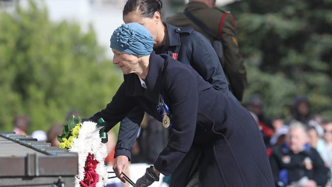 Professor Kate Warner lays the first wreath at the ANZAC Day march and service in Hobart. Picture: LUKE BOWDEN