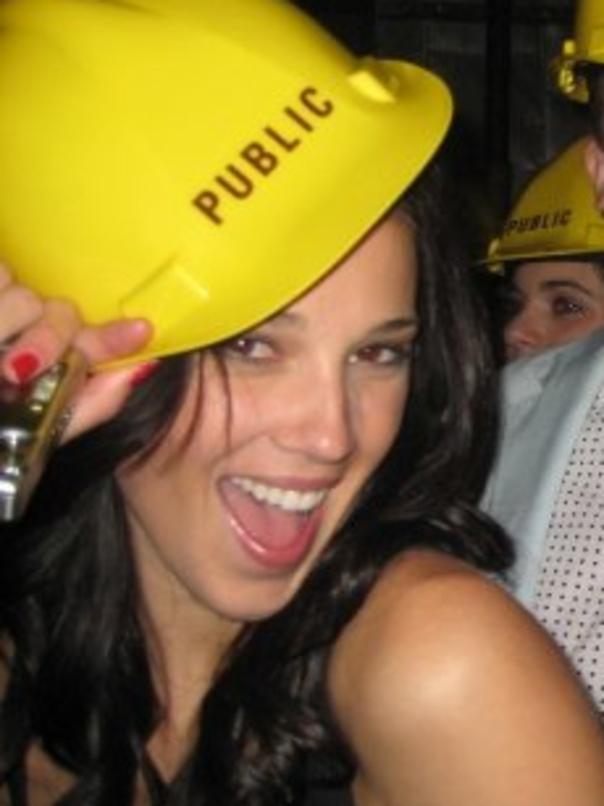 Yarbrough wears a hard hat in a nightclub.