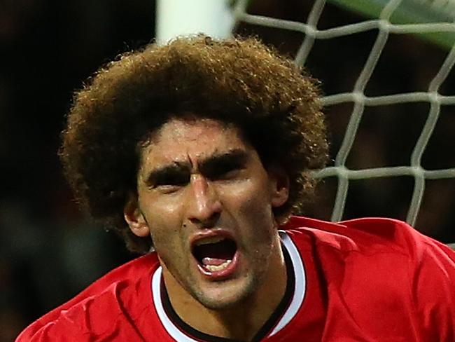 MANCHESTER, ENGLAND - DECEMBER 02: Marouane Fellaini of Manchester United celebrates scoring the first goal during the Barclays Premier League match between Manchester United and Stoke City at Old Trafford on December 2, 2014 in Manchester, England. (Photo by Alex Livesey/Getty Images)