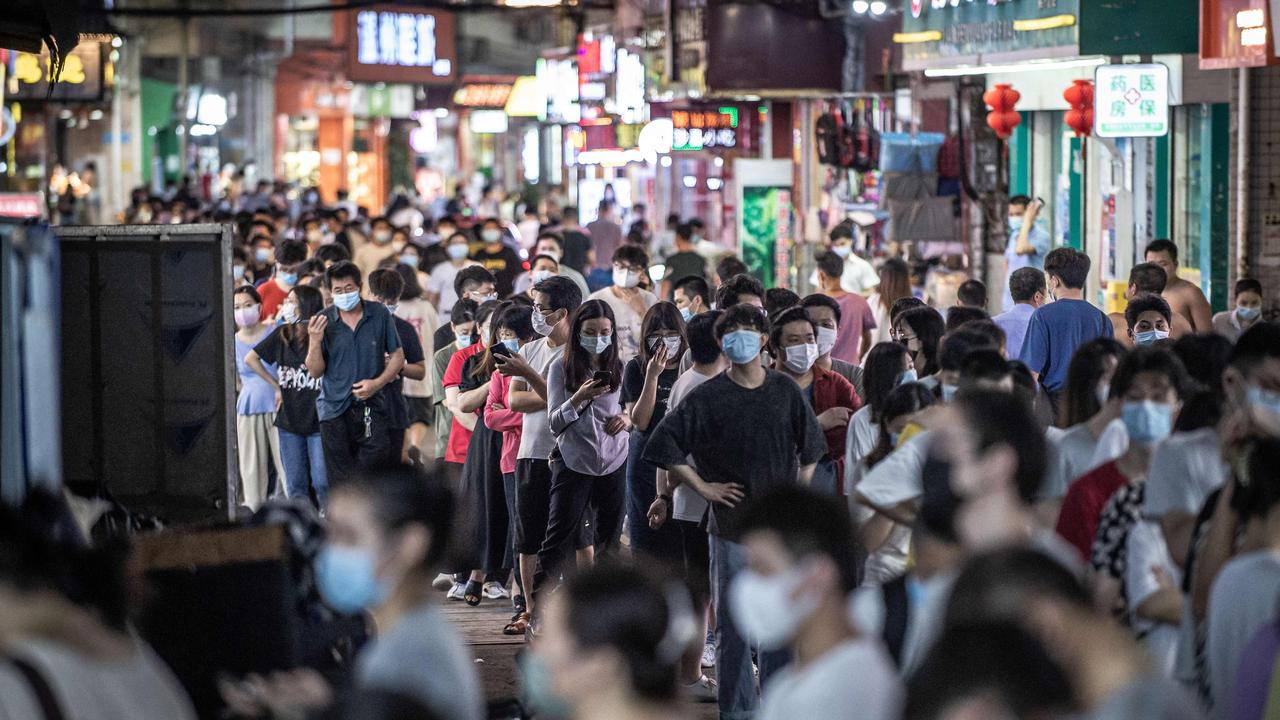 Residents queuing to undergo nucleic acid tests for the Covid-19 coronavirus in Guangzhou in April. (Photo by AFP) / China OUT