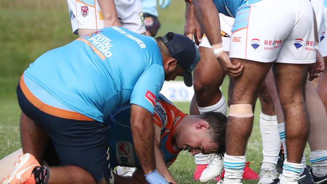 Northern Pride runners examine Colt Salmond after a heavy collision with Mat Lamea. PICTURE: BRENDAN RADKE