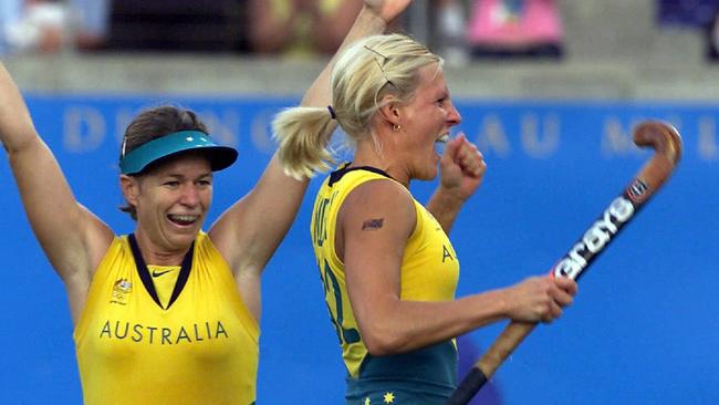 \ Renita Garard and Nikki Hudson celebrate a goal.