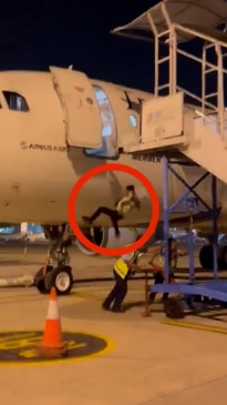 Airline worker plummets out of plane door as staff remove stairs