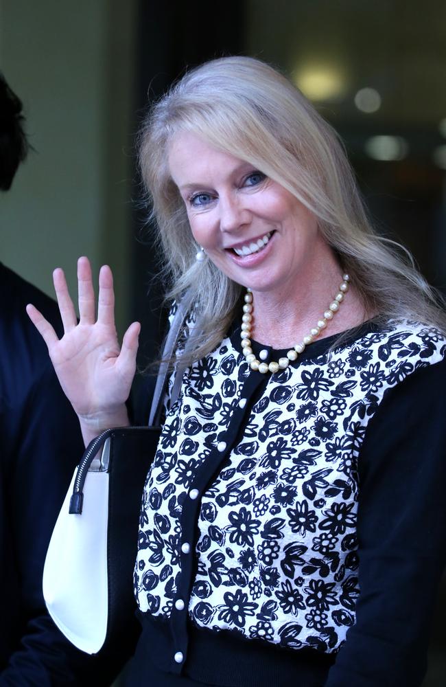 Shari-Lea Hitchcock waves to cameras at the Downing Centre Court. Picture: John Grainger