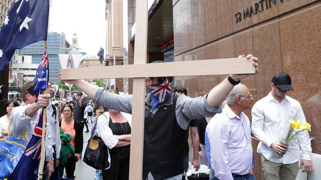 A protest of Australia First Party supporters in 2014 is meet with hostility next to the memorial for terrorist siege victims in Martin Place. Picture: Stephen Cooper