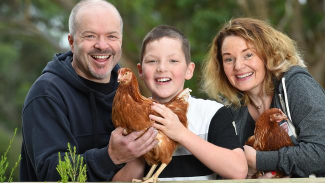 Darren, Benjamin and Rebecca Walker with their new chickens from Talking Hens in Merricks. Picture: Josie Hayden