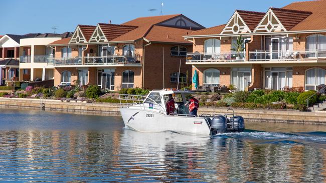 EPA scientists sampling the water, fish and crustaceans at West Lakes on Wednesday August 26, 2020, following the discovery of PFAS in samples from the old Port Adelaide Wastewater Treatment Plant nearby. Sewage sludge from the plant was used as fill on some properties during the development of West Lakes.