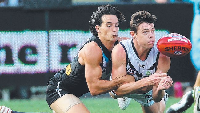 10/5/14 - AFL Round 8 - Port Adelaide v Fremantle at Adelaide Oval - Kane Mitchell tackles Lachie Neale Picture Simon Cross