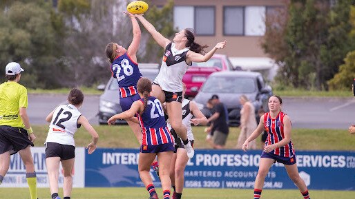 A ruck contest between the Southport and Grange girls.