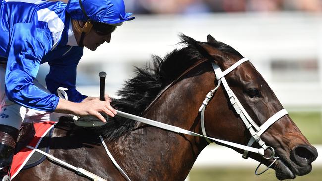 Hugh Bowman rides Winx to victory in the Caulfield Stakes.