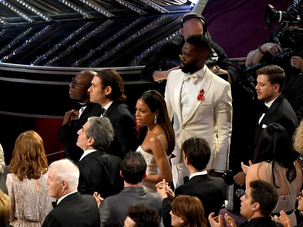 Writer/director Barry Jenkins, producer Jeremy Kleiner, actress Naomie Harris, writer Tarell Alvin McCraney look on from the audience as ‘Moonlight’ is announced as the Best Picture winner (instead of ‘La La Land,’ originally announced as the winner due to a presentation error). Picture: AFP