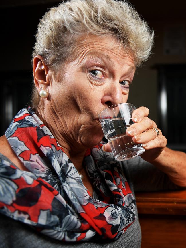 Katherine Mayor Fay Miller enjoys a gulp of water from the once contaminated council water source. Picture: Justin Kennedy