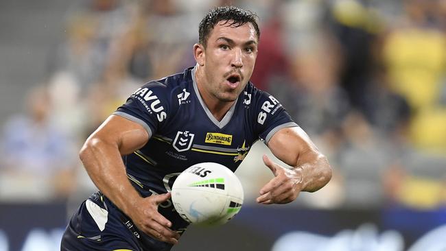 Reece Robson of the Cowboys passes the ball during a match in Townsville last year. Picture: Ian Hitchcock/Getty Images