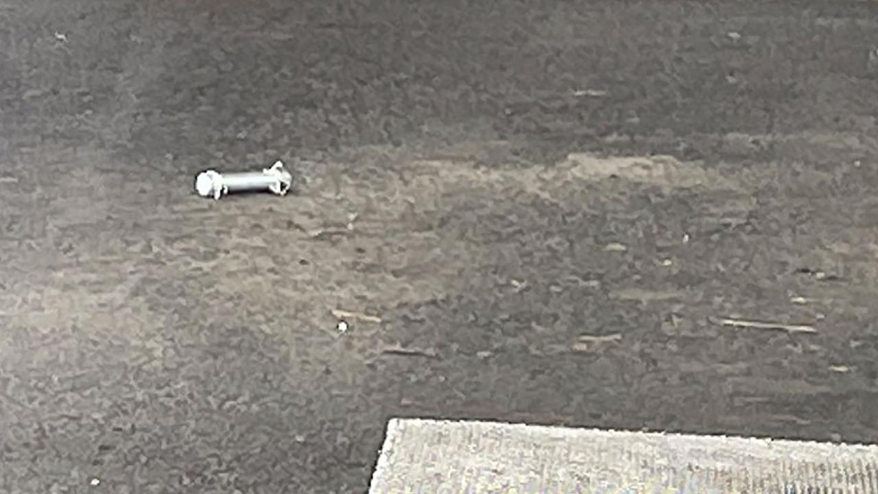 A cylinder-shaped object (left), believed to have been thrown during Japan's Prime Minister Fumio Kishida's campaign. Picture: JIJI Press / AFP / Japan OUT