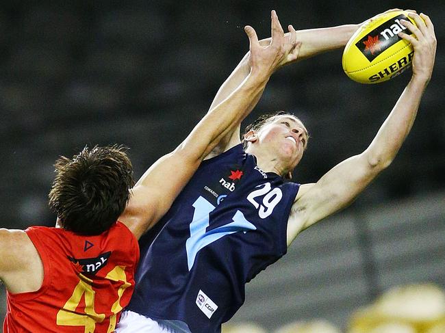 MELBOURNE, AUSTRALIA - JULY 04: James Blanck of Vic Metro marks the ball against Hugo Munn of South Australia during the U18 AFL Championship match between Vic Metro and South Australia at Etihad Stadium on July 4, 2018 in Melbourne, Australia.  (Photo by Michael Dodge/Getty Images)