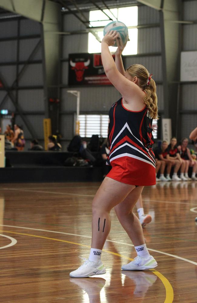 Netball action from QISSN 2024 in Townsville. Carmel College v Shalom College