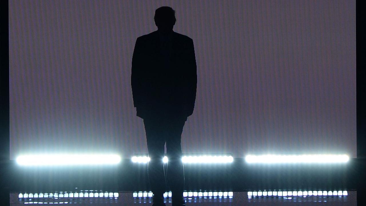 TOPSHOT - Presumptive Republican presidential candidate Donald Trump takes the stage on the first day of the Republican National Convention at Quicken Loans Arena in Cleveland, Ohio on July 18, 2016. The Republican Party opened its national convention, kicking off a four-day political jamboree that will anoint billionaire Donald Trump as its presidential nominee. / AFP PHOTO / Robyn Beck