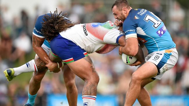 LISMORE, AUSTRALIA - FEBRUARY 27: Addin Fonua-Blake of the Warriors is tackled by Kevin Proctor and Jaimin Jolliffe of the Titans during the NRL Trial Match between the Gold Coast Titans and the New Zealand Warriors at Oaks Oval on February 27, 2021 in Lismore, Australia. (Photo by Matt Roberts/Getty Images)