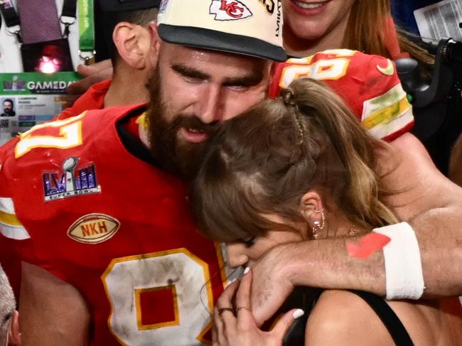 (FILES) US singer-songwriter Taylor Swift and Kansas City Chiefs' tight end #87 Travis Kelce embrace after the Chiefs won Super Bowl LVIII against the San Francisco 49ers at Allegiant Stadium in Las Vegas, Nevada, February 11, 2024. Kelce is helping survivors of the shooting that marred the Kansas City Chiefs' Super Bowl victory parade, after his world-famous girlfriend Swift did the same, NBC news reported on February 17, 2024. The shooting on February 14 left one woman dead and 22 people injured â including two girls in the Reyes family. Kelce's Eighty-Seven Running foundation made two $50,000 donations to a GoFundMe raising money to support the Reyes family, a Kelce representative confirmed to NBC. (Photo by Patrick T. Fallon / AFP)