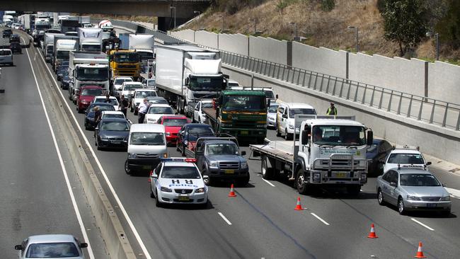 Three trucks and a car collided on the M4 westbound forcing the closure of all westbound lanes.