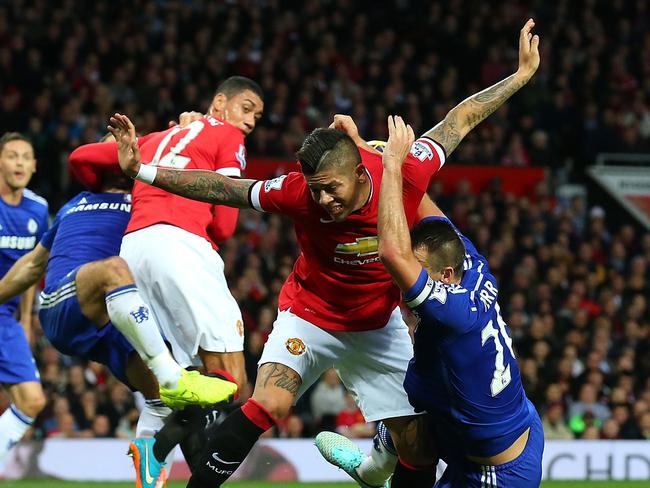 MANCHESTER, ENGLAND - OCTOBER 26: John Terry of Chelsea tangles in the penalty area with Marcos Rojo of Manchester United during the Barclays Premier League match between Manchester United and Chelsea at Old Trafford on October 26, 2014 in Manchester, England. (Photo by Alex Livesey/Getty Images)