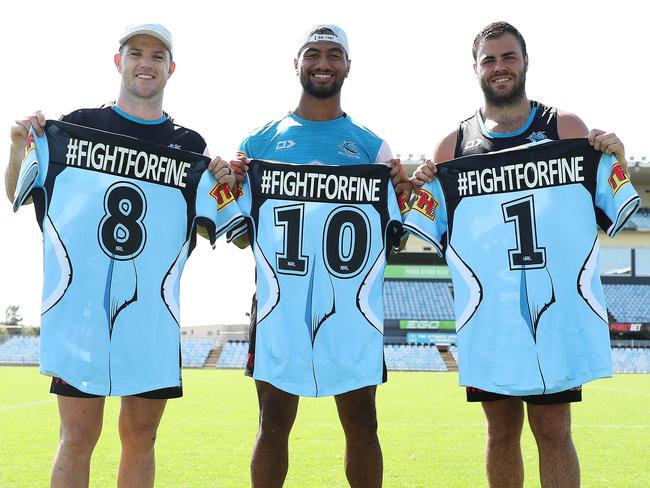 Chad Townsend, Ronaldo Mulitalo and Wade Graham hold their NRL Nines jersey which is dedicated to their team mate Fine Kula. Picture: Brett Costello